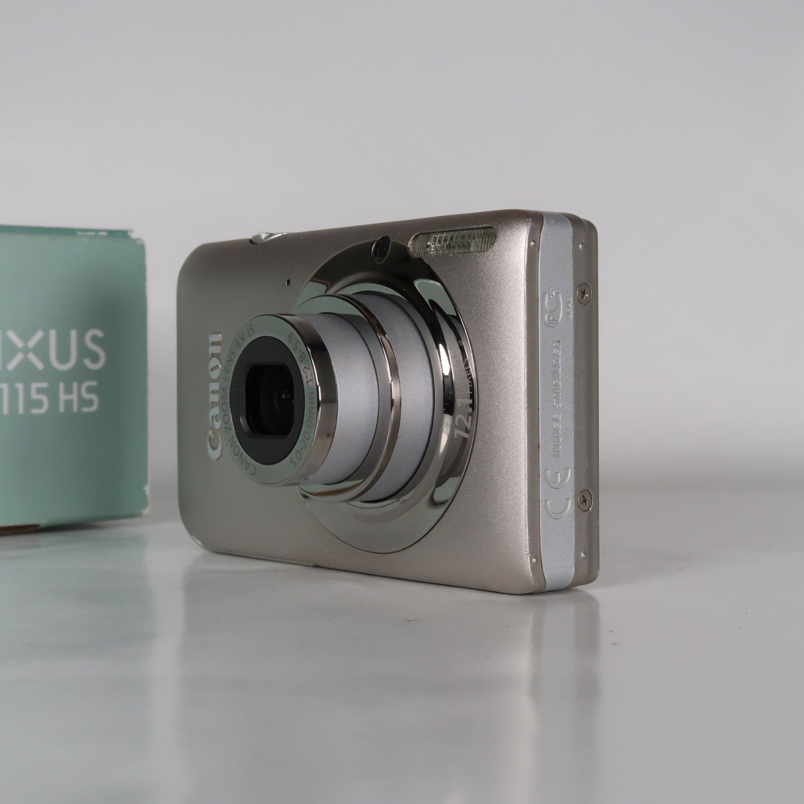Canon IXUS 115 HS PowerShot ELPH 100 HS 12.1MP 4x Digital Camera Silver – Very Good Condition