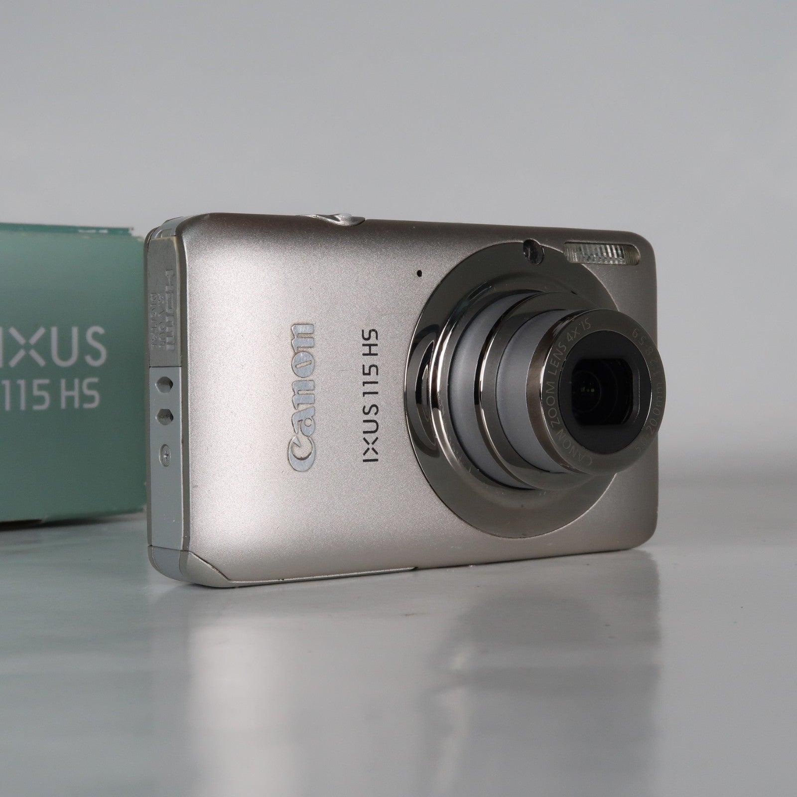 Canon IXUS 115 HS PowerShot ELPH 100 HS 12.1MP 4x Digital Camera Silver – Very Good Condition