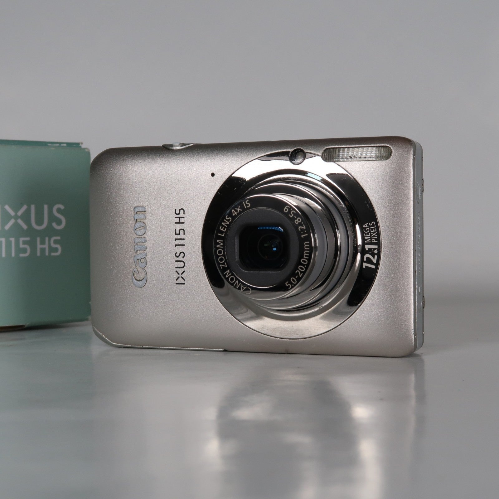Canon IXUS 115 HS PowerShot ELPH 100 HS 12.1MP 4x Digital Camera Silver – Very Good Condition