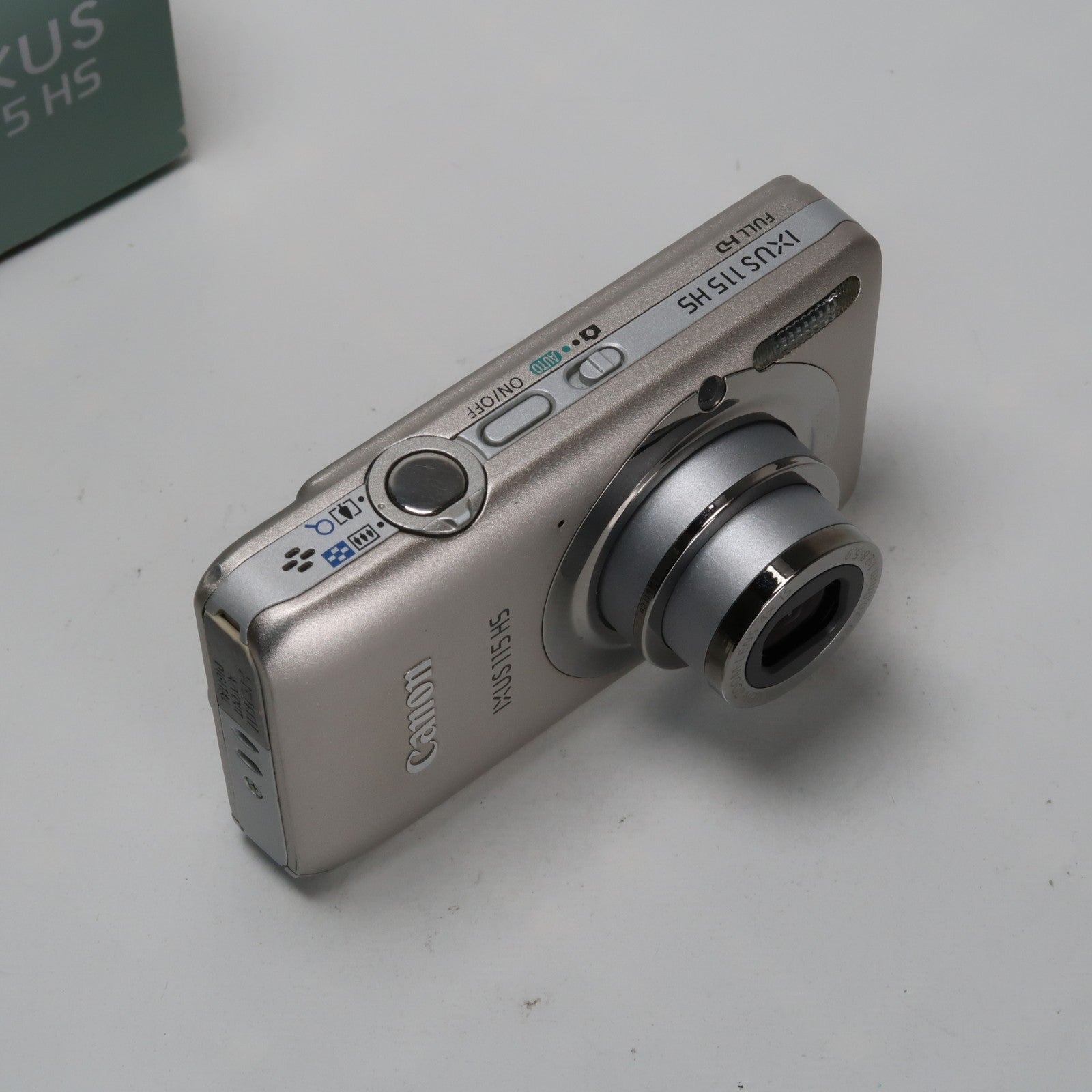 Canon IXUS 115 HS PowerShot ELPH 100 HS 12.1MP 4x Digital Camera Silver – Very Good Condition
