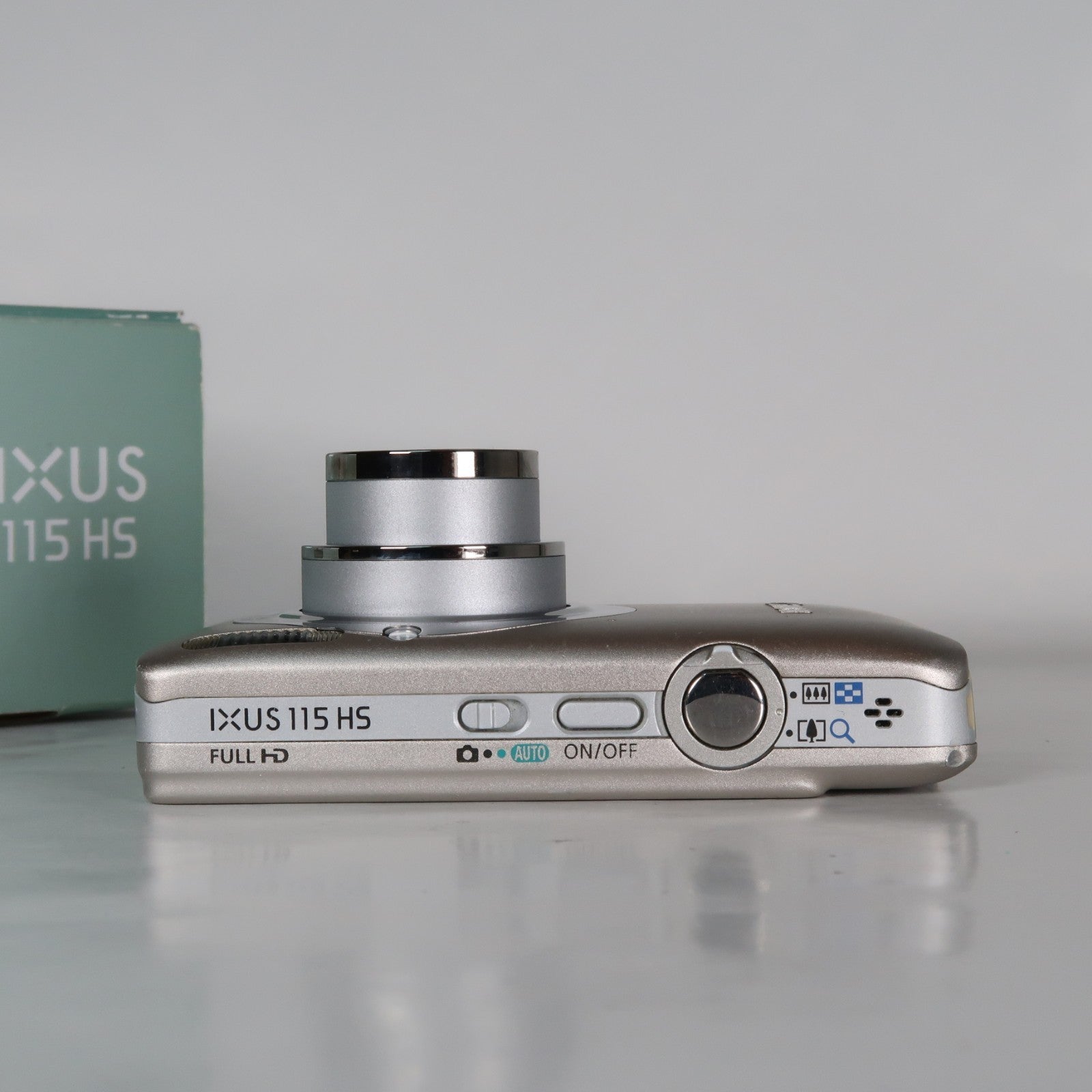 Canon IXUS 115 HS PowerShot ELPH 100 HS 12.1MP 4x Digital Camera Silver – Very Good Condition