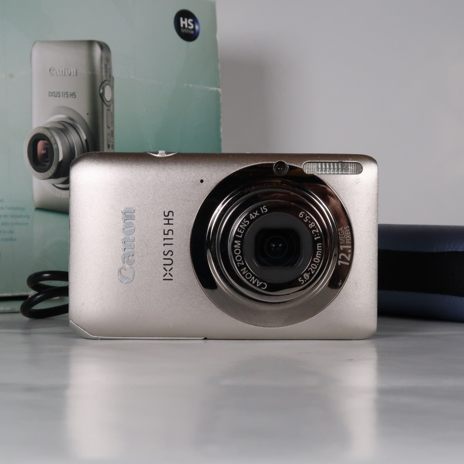 Canon IXUS 115 HS PowerShot ELPH 100 HS 12.1 MP 4x Digital Camera Silver