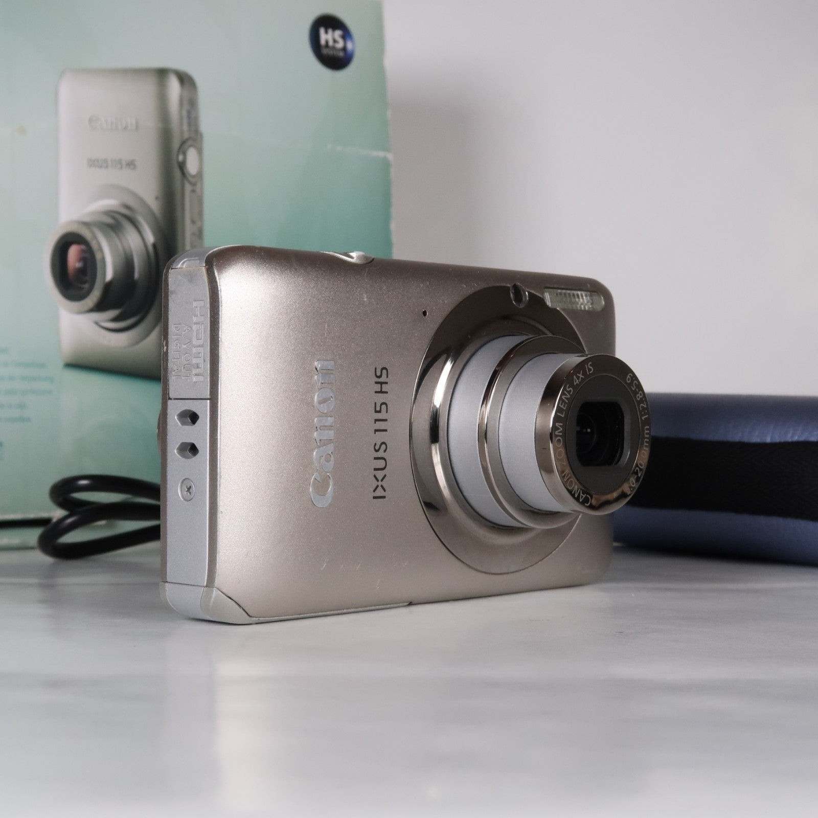 Canon IXUS 115 HS PowerShot ELPH 100 HS 12.1 MP 4x Digital Camera Silver