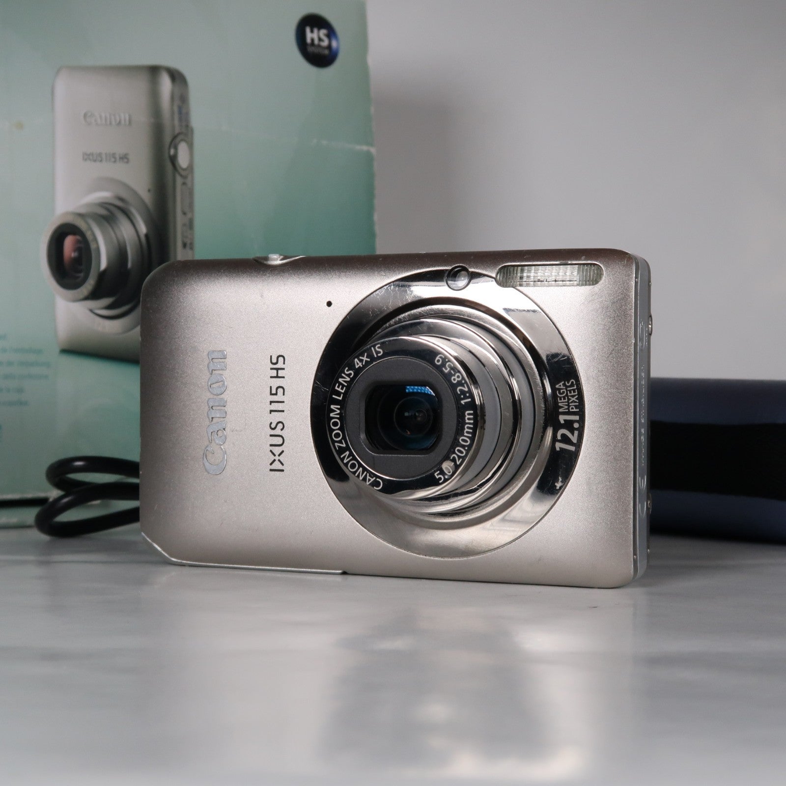 Canon IXUS 115 HS PowerShot ELPH 100 HS 12.1 MP 4x Digital Camera Silver