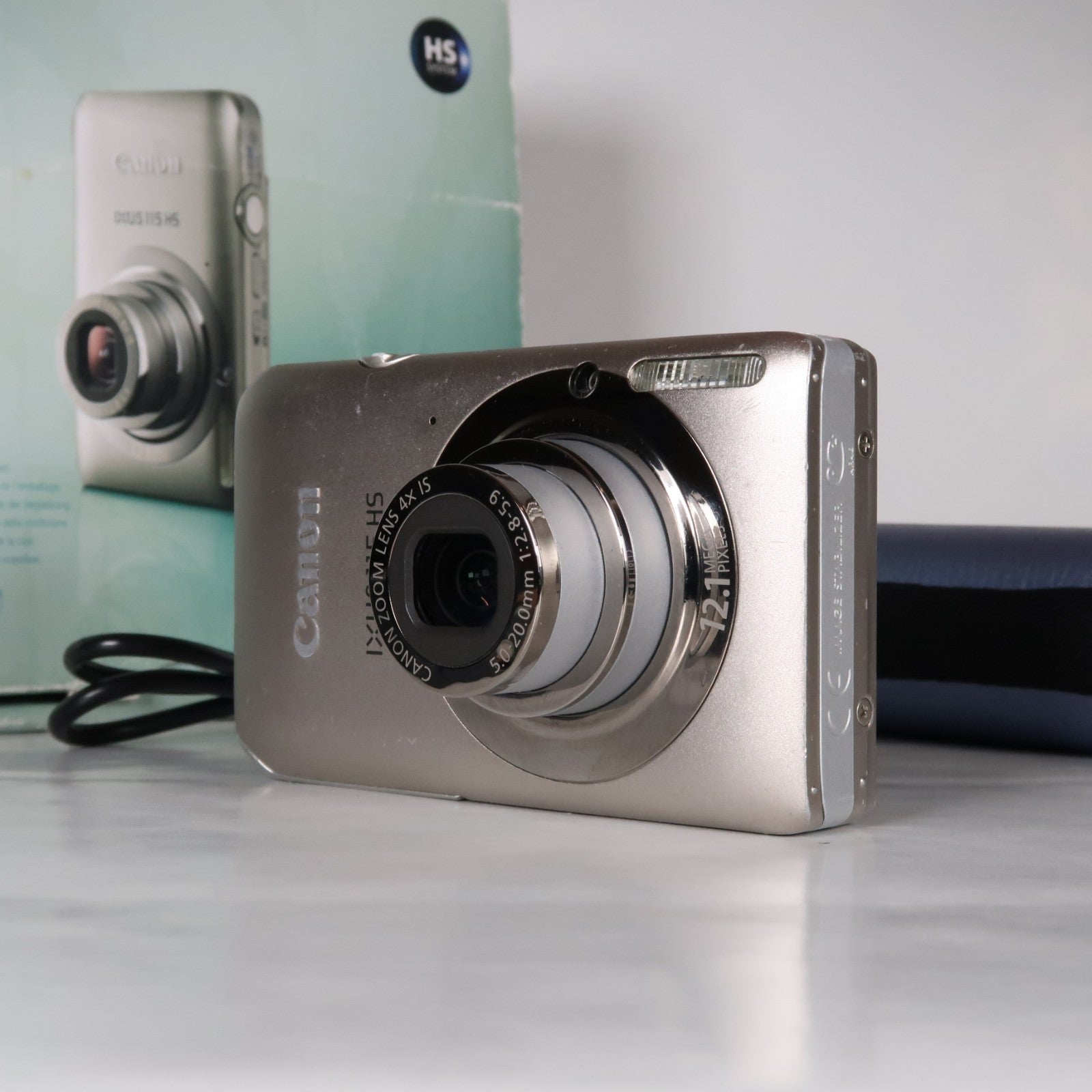 Canon IXUS 115 HS PowerShot ELPH 100 HS 12.1 MP 4x Digital Camera Silver